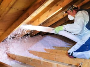 Applying spray foam insulation in wall cavities by Attis Insulation near Lackawanna County, PA